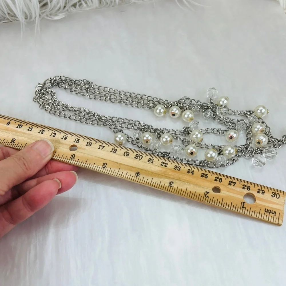 Super fun, Silvertone and white reflective beaded draping costume necklace
